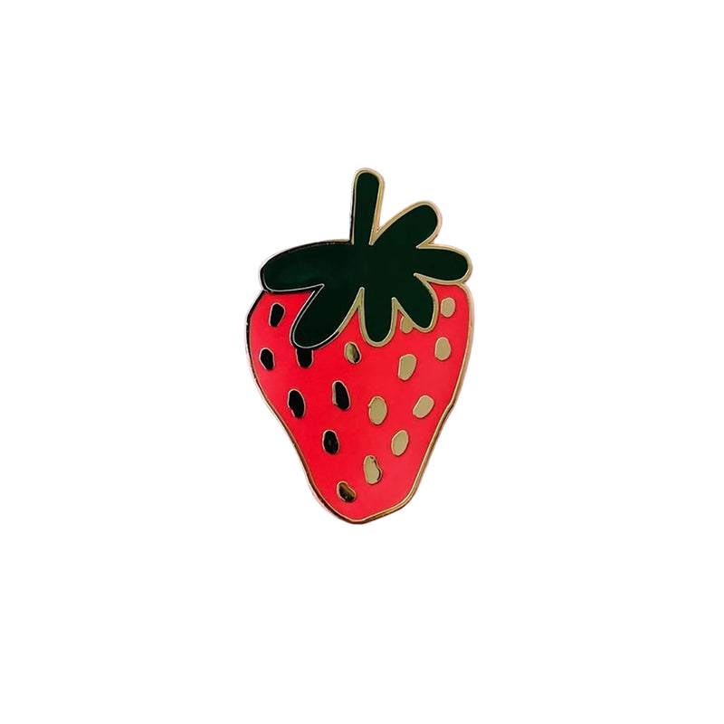 Strawberry-shaped pin on a white background