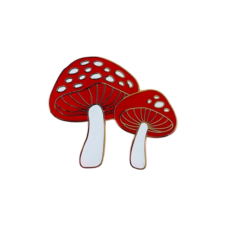 Two red mushroom pins with white stems on a white background