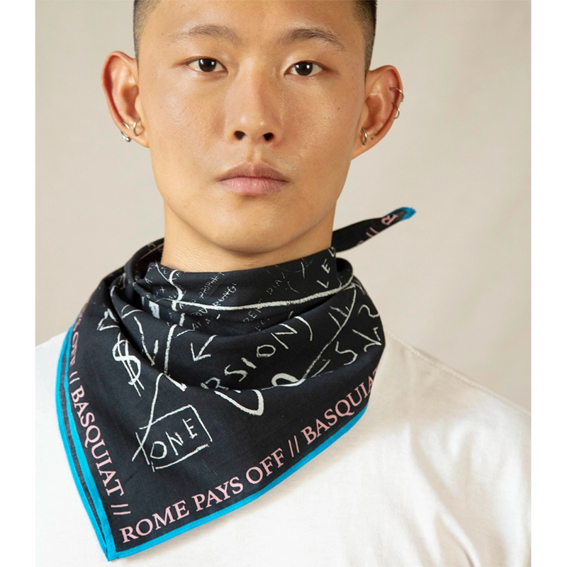 Bandana of Basquiat artwork, Beat Bop styled about the neck on a male model 
