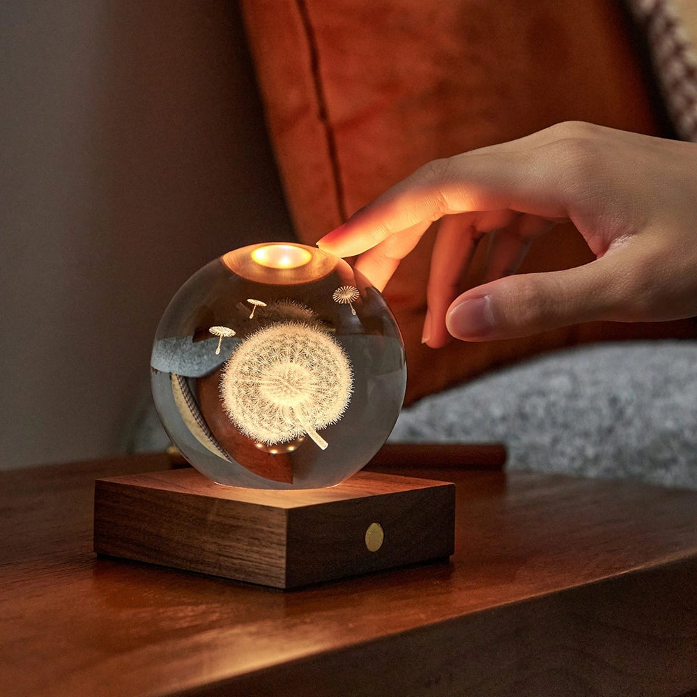 Gingko Amber Crystal Light Lifestyle with hand touching lit up light