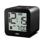 Black digital clock with digital display on a white background