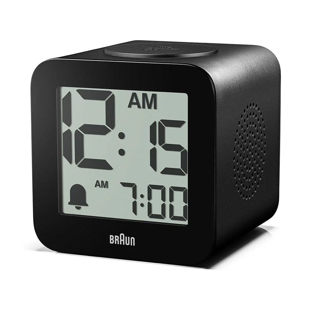 Black digital clock with digital display on a white background