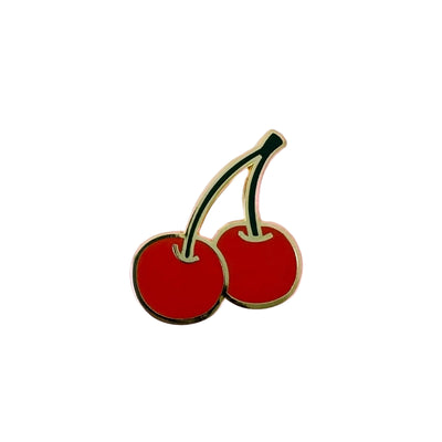 Cherry-shaped pin on a white background