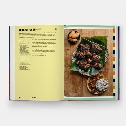 Open cookbook showing a page with jerk chicken recipe and preparation.