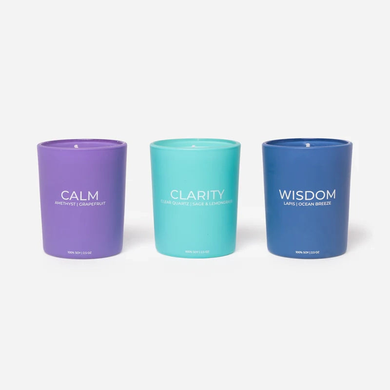 set of 3 candles that say calm, clarity, wisdom on each candle 