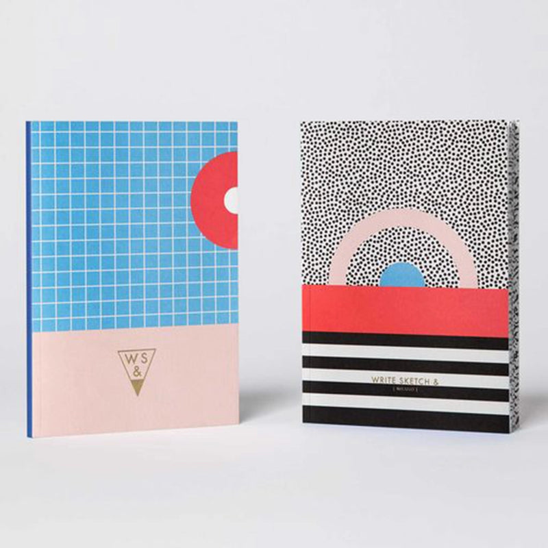 single paper cover notebook in black, white, blue, and red