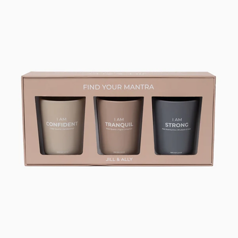 set of 3 candles in a mauve colored box 